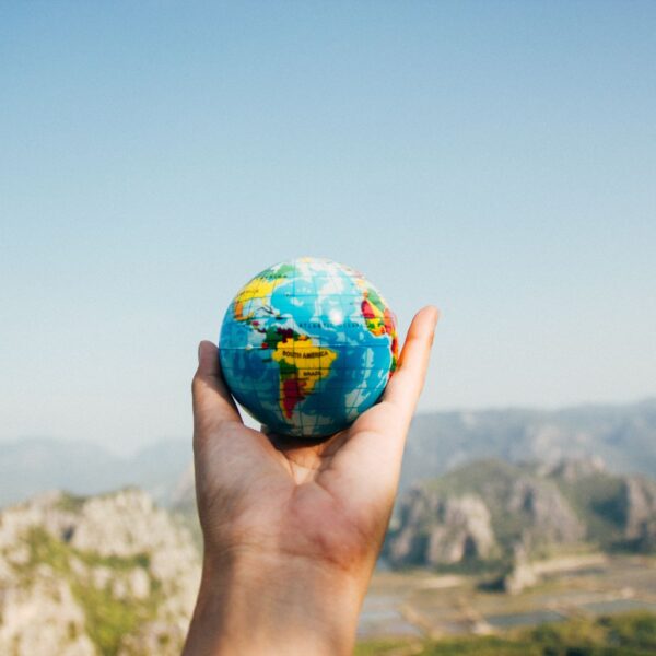person holding a globe