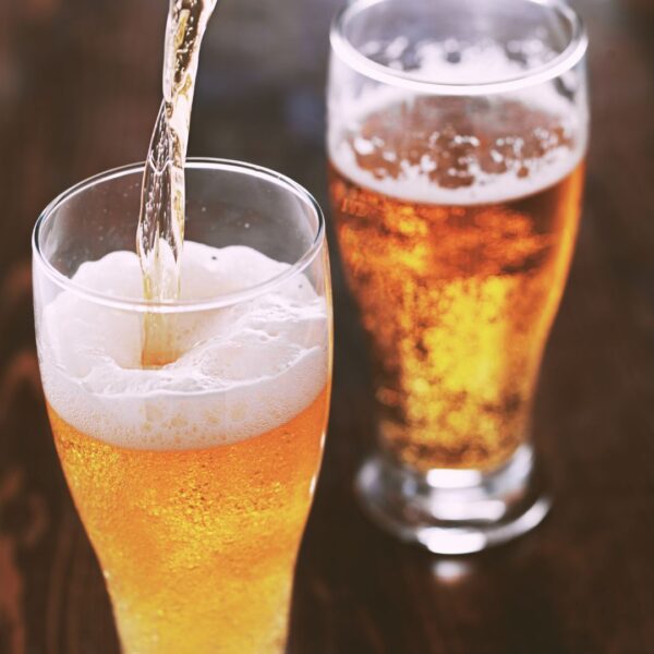 pouring beer into glasses